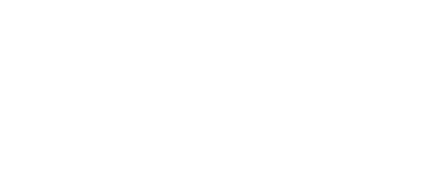 A man is riding a bike on a hill in Suffolk, enjoying the scenic views and breezy ride.